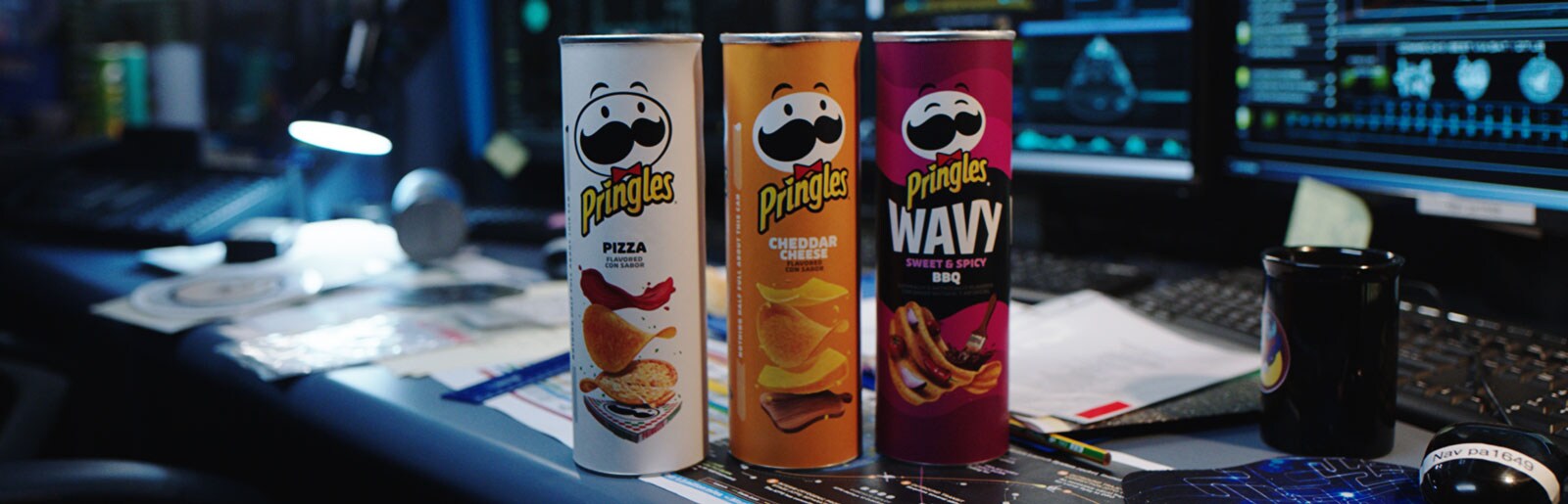 Pringles cans on a space mission control desk.
