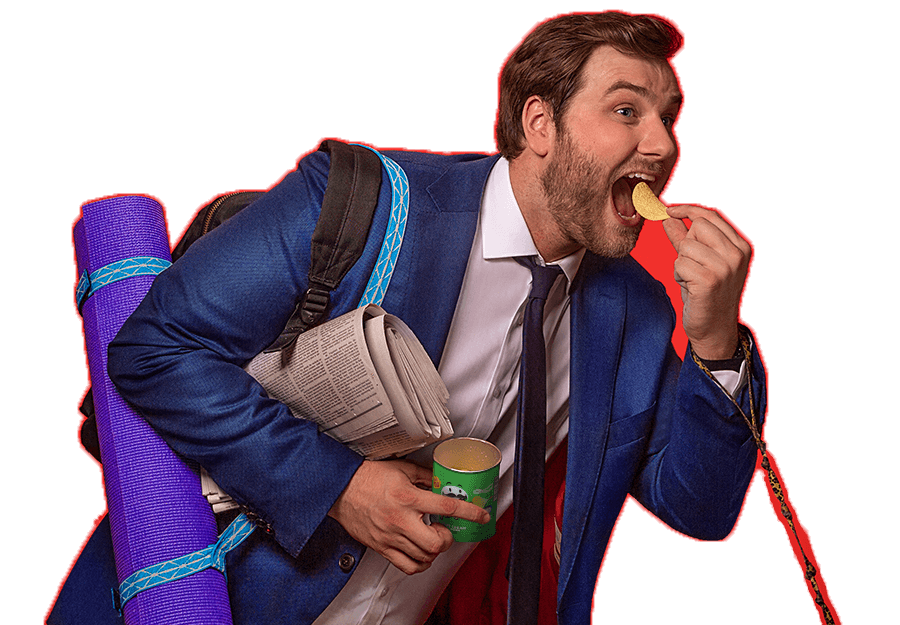 A man on the go eating a Pringles Crisp